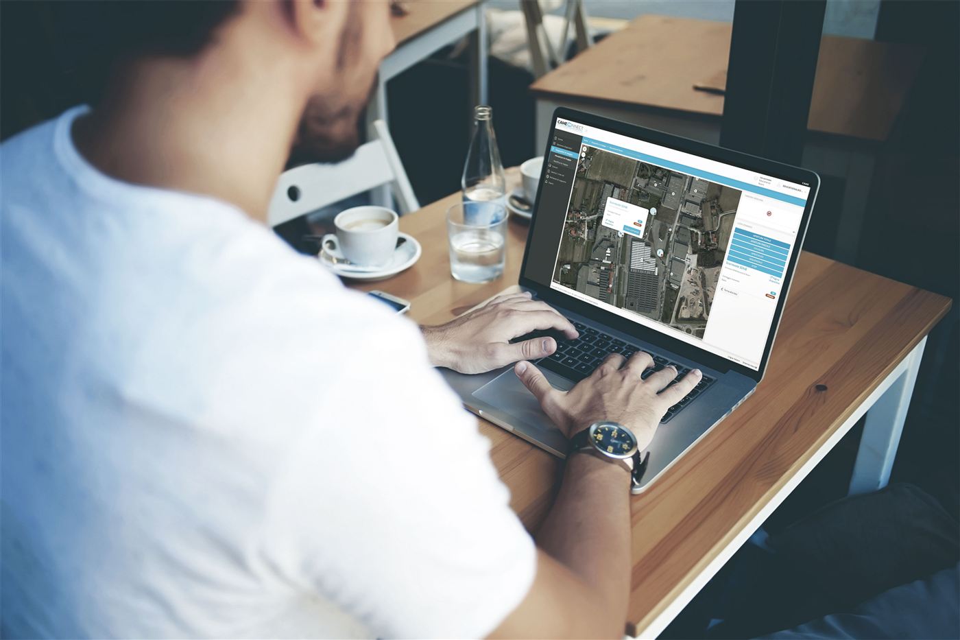 Person using the CAME Connect app on a laptop to remotely control their gate and access system